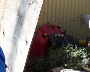 Gasoline cans and barbecue